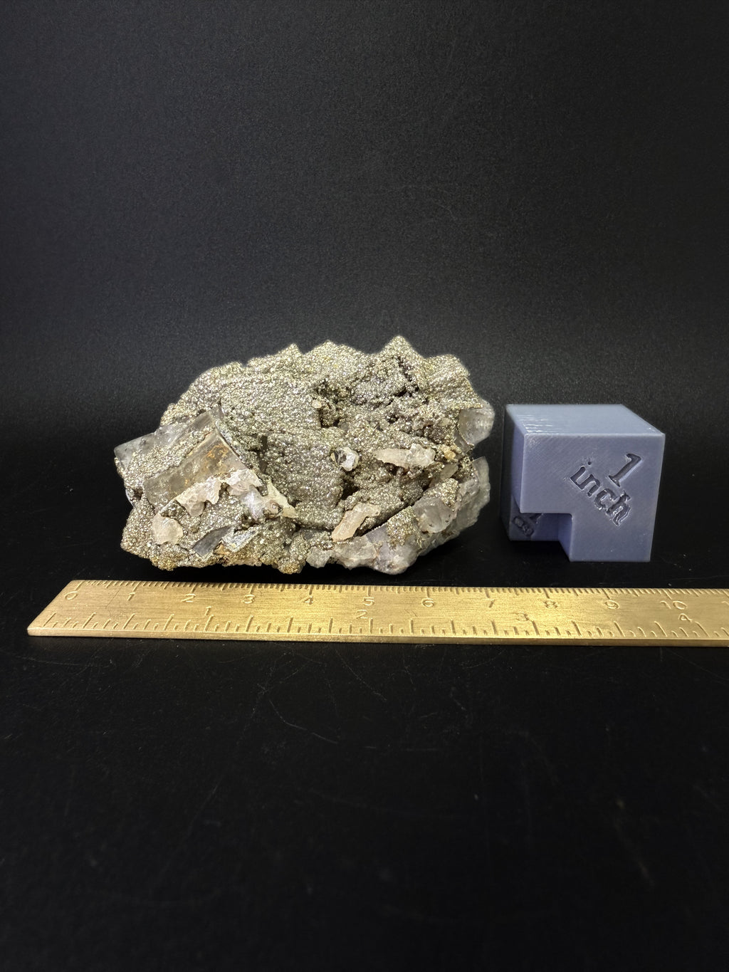 Pyrite on Fluorite
