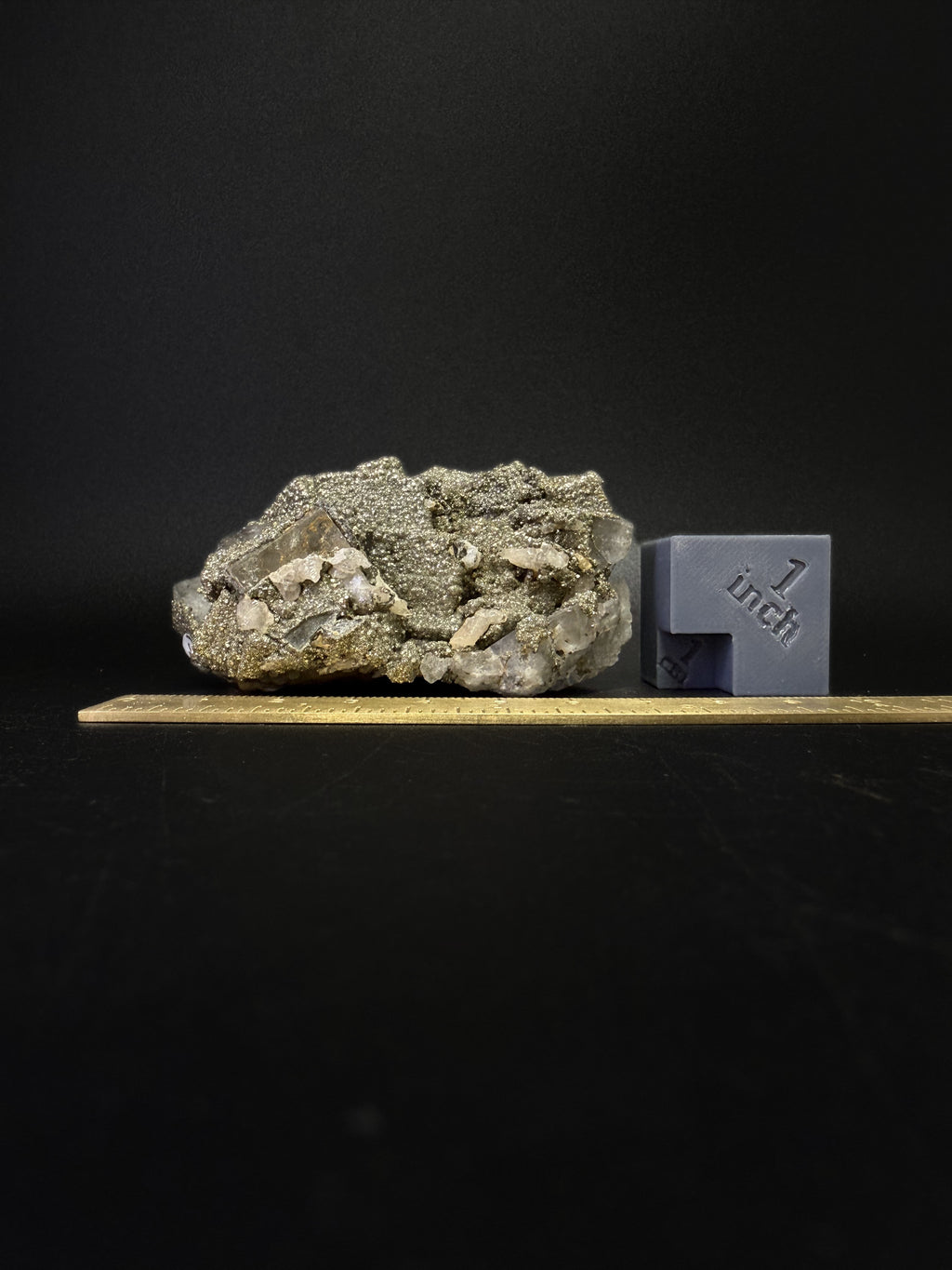 Pyrite on Fluorite