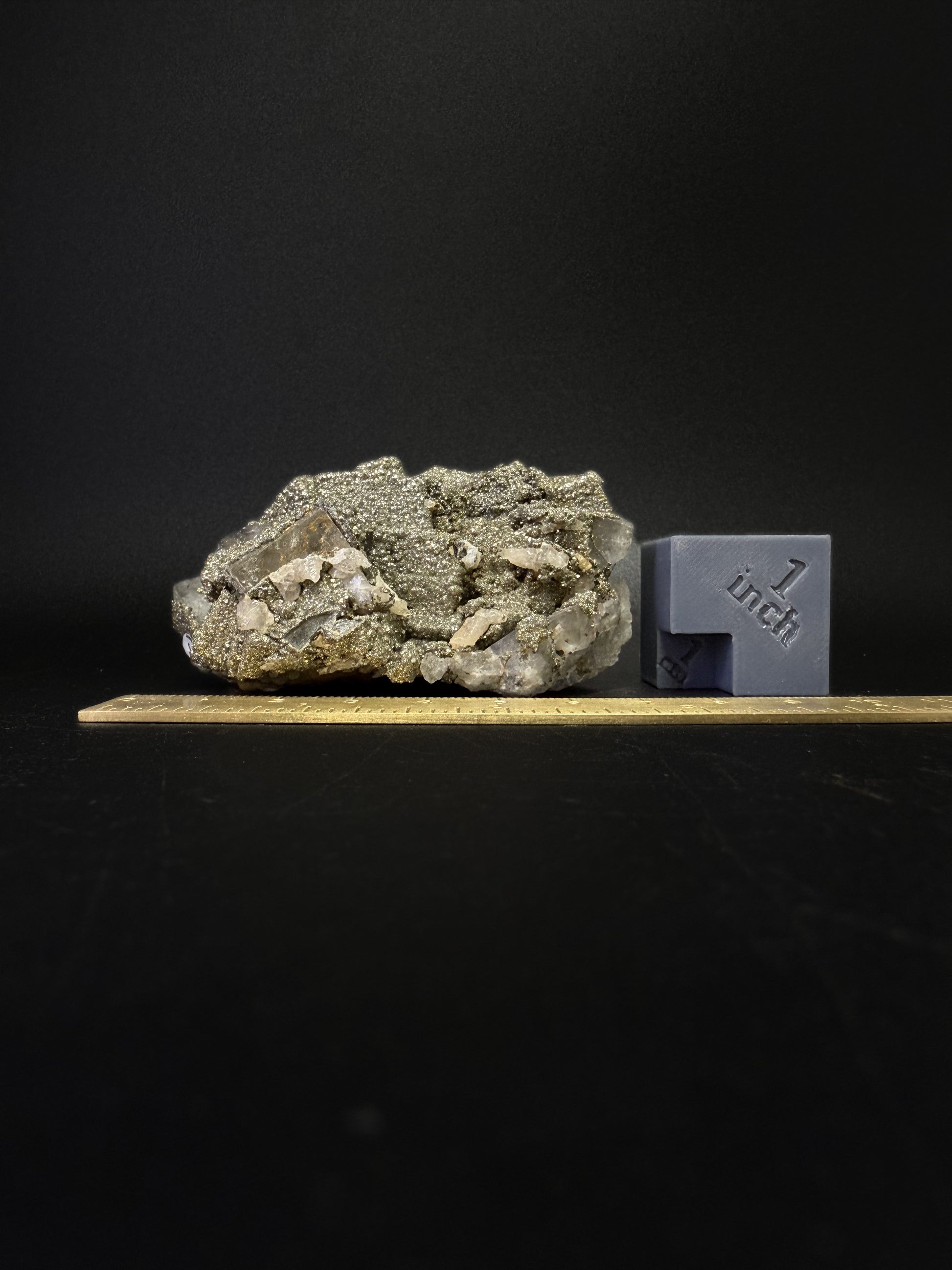 Pyrite on Fluorite